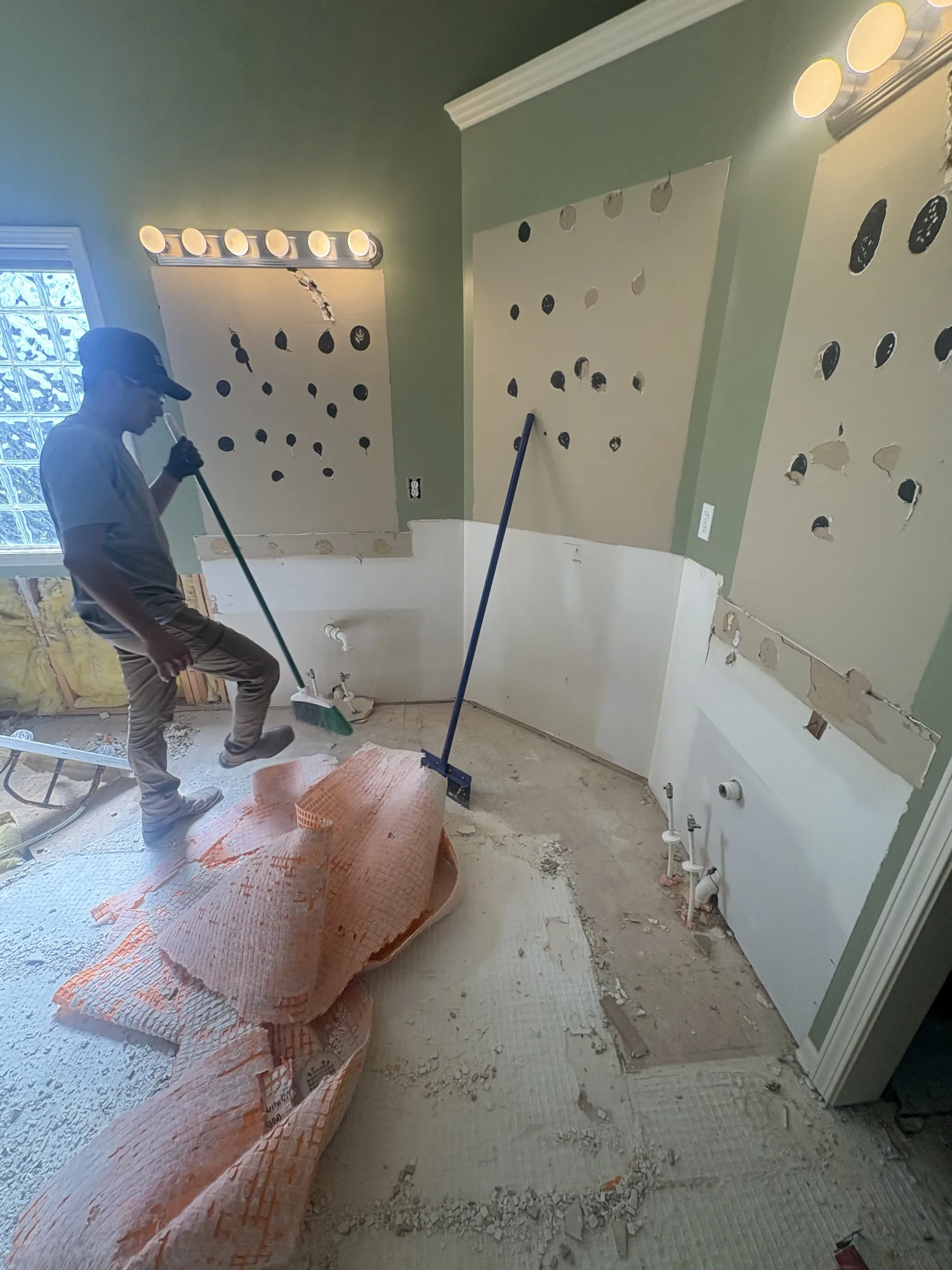 man, broom, mop, light, wall, floor, window, plastic sheeting