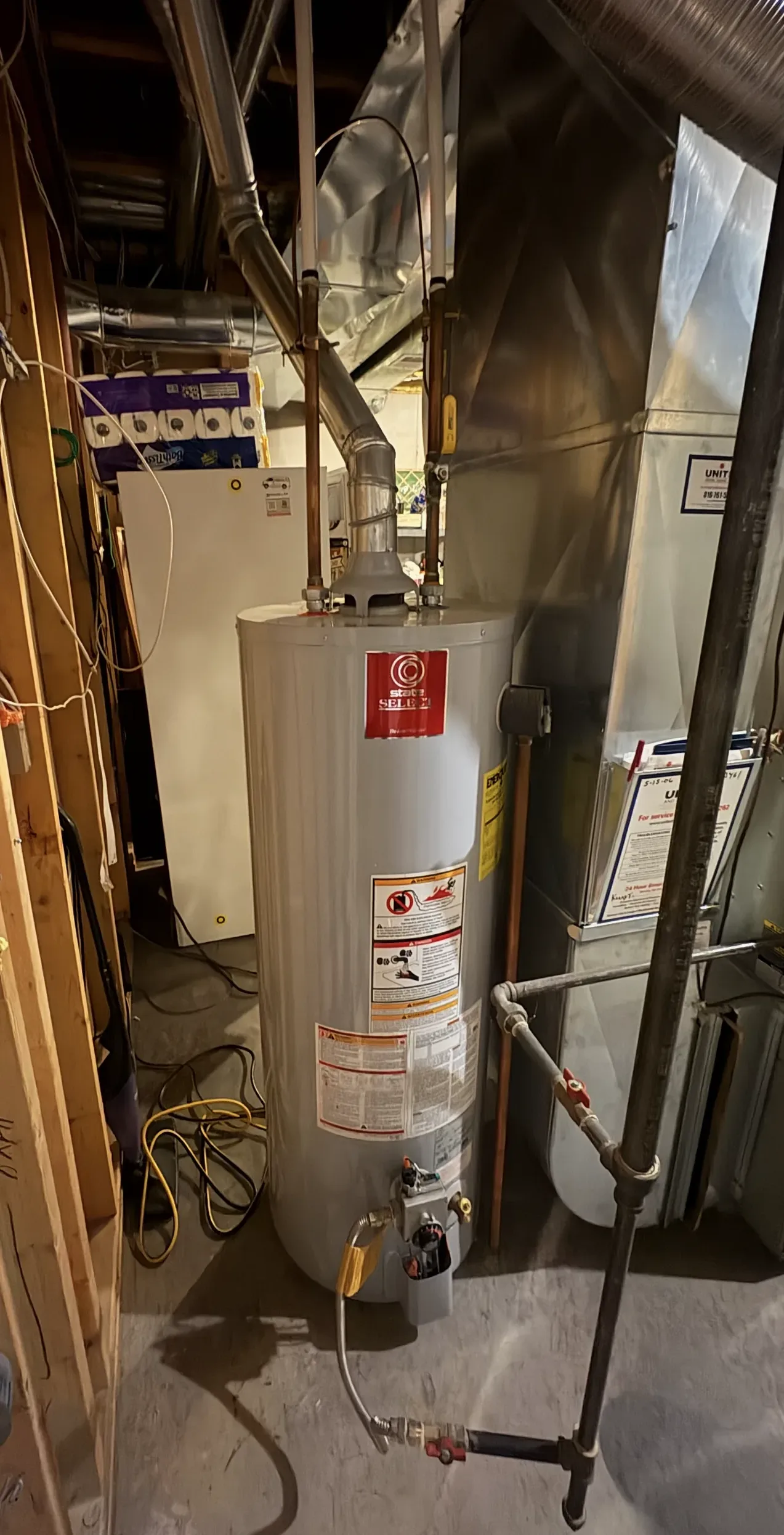 water heater, ductwork, pipes, copper pipe, wood framing, cement floor